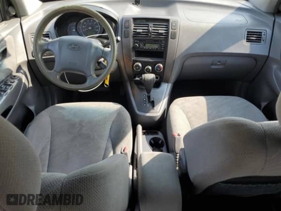 2005 Hyundai Tucson GL z VIN KM8JM12B75U180957, wystawiony jako Copart lot #62412015 z przebiegiem 222 710 mil mil oraz Szkoda całkowita • Salvage title. Historia ofert i sprzedaży dostępna na DreamBid. Obrazek 8.