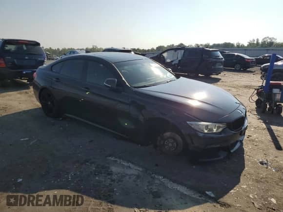 2015 BMW 4 Series 428i xDrive z VIN WBA4C9C59FD330304, wystawiony jako Copart lot #64786165 z przebiegiem 156 889 mil mil oraz Szkoda całkowita • Salvage title. Historia ofert i sprzedaży dostępna na DreamBid. Obrazek 4.