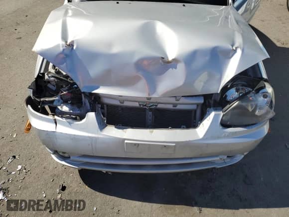 2005 Hyundai Accent GLS с VIN KMHCG35C05U331928, выставлен на аукционе Copart как лот 74672614 с пробегом 41 542 миль миль и Списание • Salvage title. История ставок и продаж доступна на DreamBid. Изображение 12.