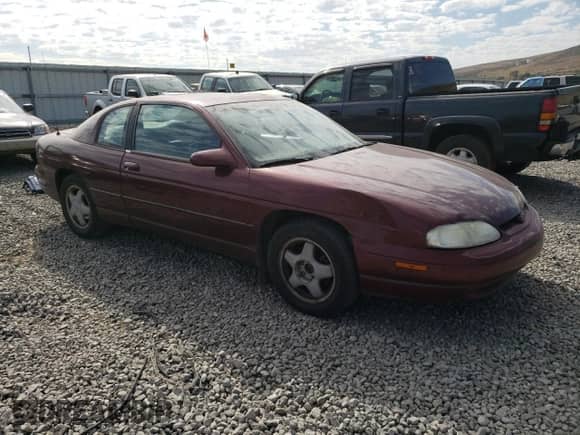 1997 Chevrolet Monte Carlo with VIN 2G1WX12X8V9282870, listed as a Copart auction lot 74389364 with 104,425 mi miles and Salvage title. Bid and sale history available at DreamBid. Image 4.