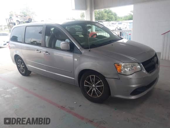 2014 Dodge Grand Caravan SE with VIN 2C4RDGBG3ER412053, listed as a IAAI auction lot 42663202 with 246,888 mi miles and . Bid and sale history available at DreamBid. Image 1.