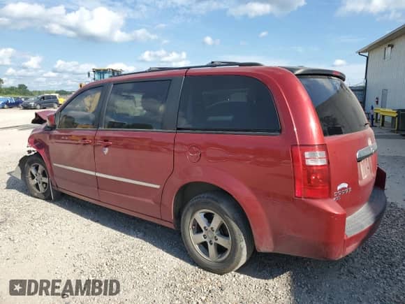 2010 Dodge Grand Caravan SXT with VIN 2D4RN5DX5AR125907, listed as a Copart auction lot 69637335 with 211,789 mi miles and Salvage title. Bid and sale history available at DreamBid. Image 2.