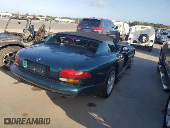 1995 Dodge Viper with VIN 1B3BR65E9SV201019, listed as a Copart auction lot 77252124 with Not provided miles and Non repairable. Bid and sale history available at DreamBid. Image 3.