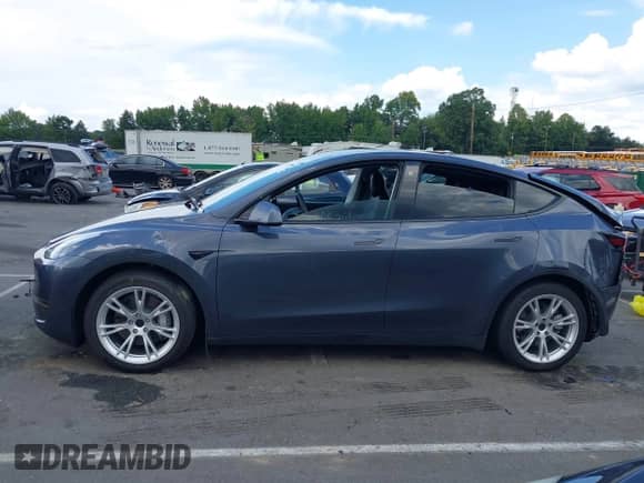 2021 Tesla Model Y Long Range with VIN 5YJYGAEE6MF251590, listed as a IAAI auction lot 43066576 with 33,937 mi miles and . Bid and sale history available at DreamBid. Image 14.