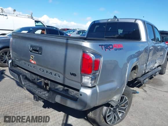 2022 Toyota Tacoma SR5 z VIN 3TMDZ5BN6NM122590, wystawiony jako IAAI lot #41714578 z przebiegiem 56 472 mil mil oraz . Historia ofert i sprzedaży dostępna na DreamBid. Obrazek 4.