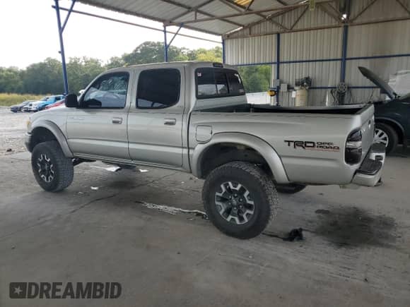 2002 Toyota Tacoma z VIN 5TEHN72N42Z042373, wystawiony jako Copart lot #71019875 z przebiegiem 297 085 mil mil oraz Szkoda całkowita • Salvage title. Historia ofert i sprzedaży dostępna na DreamBid. Obrazek 2.