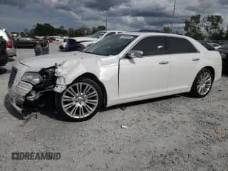 2014 Chrysler 300 C с VIN 2C3CCAET6EH355310, выставлен на аукционе Copart как лот 70996205 с пробегом 172 952 миль миль и Списание • Salvage title. История ставок и продаж доступна на DreamBid. Изображение 1.