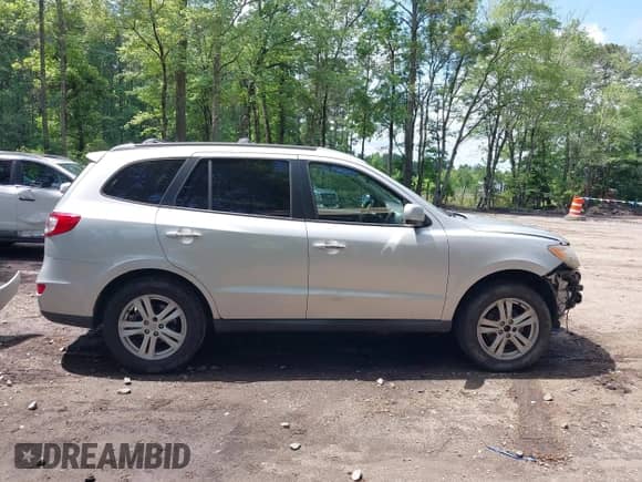 2012 Hyundai Santa Fe Limited with VIN 5XYZK4AG8CG107932, listed as a IAAI auction lot 42445878 with 185,237 mi miles and . Bid and sale history available at DreamBid. Image 13.