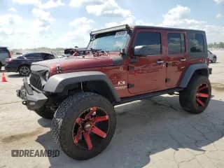 2008 Jeep Wrangler Unlimited X z VIN 1J4GA39148L574890, wystawiony jako Copart lot #62991305 z przebiegiem 187 036 mil mil oraz Szkoda całkowita • Salvage title. Historia ofert i sprzedaży dostępna na DreamBid. Obrazek 1.