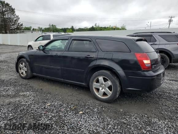 2005 Dodge Magnum SXT with VIN 2D4GZ48V85H576310, listed as a Copart auction lot 61059975 with 175,541 mi miles and Salvage title. Bid and sale history available at DreamBid. Image 2.