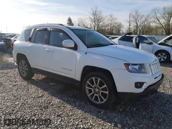 2017 Jeep Compass Latitude with VIN 1C4NJCEA9HD130529, listed as a Copart auction lot 52049285 with 82,338 mi miles and Salvage title. Bid and sale history available at DreamBid. Image 4.