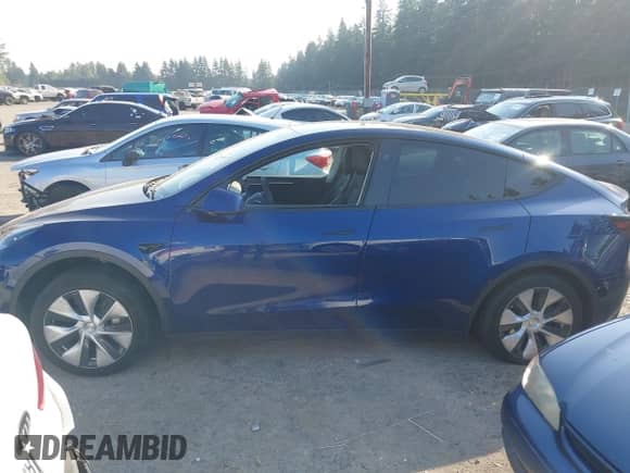 2023 Tesla Model Y Long Range with VIN 7SAYGDEE3PF957974, listed as a IAAI auction lot 43275987 with 20,712 mi miles and . Bid and sale history available at DreamBid. Image 14.