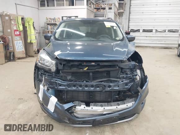 2018 Ford Escape SE with VIN 1FMCU9GD8JUB66187, listed as a IAAI auction lot 43298016 with 76,985 mi miles and . Bid and sale history available at DreamBid. Image 12.