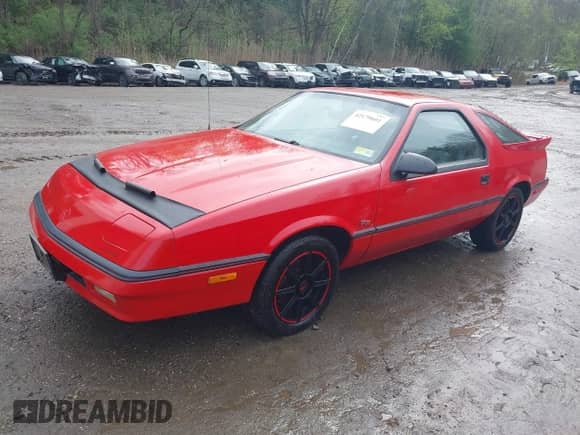 1989 Dodge Daytona with VIN 1B3XG24J5KG136306, listed as a IAAI auction lot 42179601 with 131,083 mi miles and . Bid and sale history available at DreamBid. Image 2.