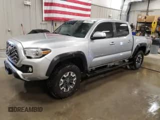 2022 Toyota Tacoma SR with VIN 3TMCZ5AN1NM465871, listed as a Copart auction lot 67643265 with 58,182 mi miles and Salvage title. Bid and sale history available at DreamBid. Image 1.