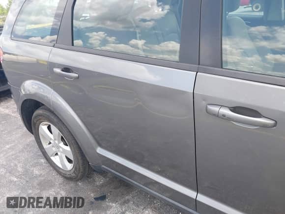 2013 Dodge Journey SE z VIN 3C4PDCAB3DT626929, wystawiony jako IAAI lot #42318702 z przebiegiem Nie podano mil oraz . Historia ofert i sprzedaży dostępna na DreamBid. Obrazek 13.