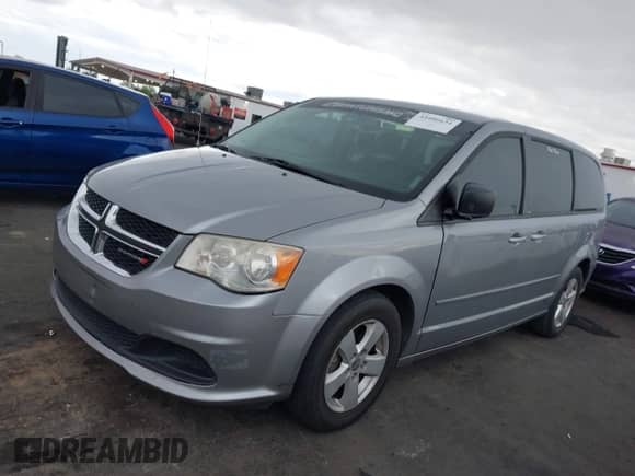 2013 Dodge Grand Caravan SE with VIN 2C4RDGBG2DR693471, listed as a IAAI auction lot 43406634 with 244,841 mi miles and . Bid and sale history available at DreamBid. Image 6.