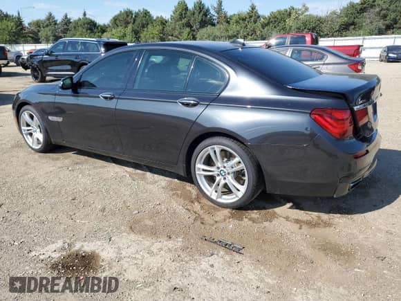 2014 BMW 7 Series 750i xDrive with VIN WBAYB6C54ED224456, listed as a Copart auction lot 71027795 with 104,442 mi miles and Salvage title. Bid and sale history available at DreamBid. Image 2.