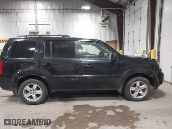 2011 Honda Pilot EX with VIN 5FNYF4H46BB014571, listed as a IAAI auction lot 43572141 with 243,613 mi miles and . Bid and sale history available at DreamBid. Image 12.