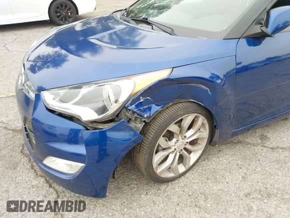 2015 Hyundai Veloster z VIN KMHTC6AD0FU243328, wystawiony jako IAAI lot #42439313 z przebiegiem 96 997 mil mil oraz . Historia ofert i sprzedaży dostępna na DreamBid. Obrazek 6.