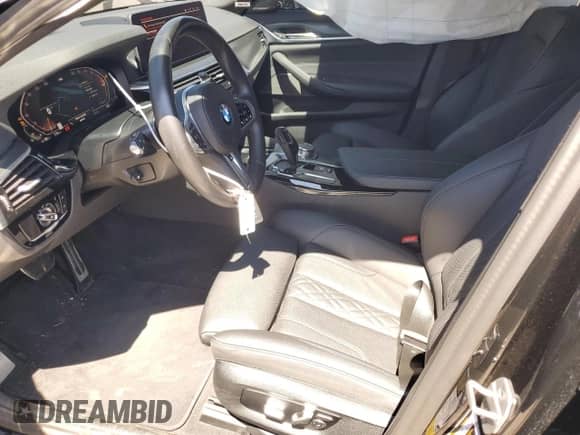 2023 BMW 5 Series 540i xDrive z VIN WBA73BJ02PWX99963, wystawiony jako Copart lot #63969205 z przebiegiem 27 720 mil mil oraz Szkoda całkowita • Salvage title. Historia ofert i sprzedaży dostępna na DreamBid. Obrazek 7.