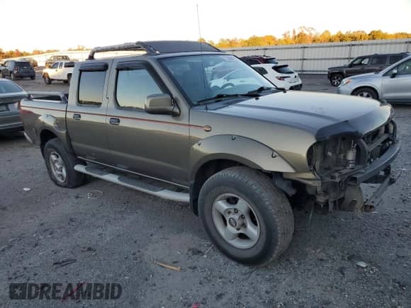 2001 Nissan Frontier SE with VIN 1N6ED27Y81C357537, listed as a Copart auction lot 77595894 with 202,092 mi miles and Salvage title. Bid and sale history available at DreamBid. Image 4.