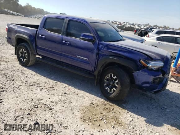 2023 Toyota Tacoma TRD Off Road z VIN 3TMCZ5ANXPM552848, wystawiony jako Copart lot #86618115 z przebiegiem 33 753 mil mil oraz Szkoda całkowita • Salvage title. Historia ofert i sprzedaży dostępna na DreamBid. Obrazek 4.