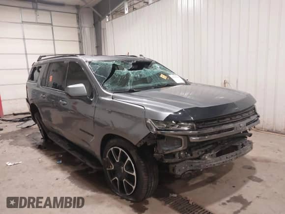 2021 Chevrolet Suburban RST z VIN 1GNSKEKD8MR486467, wystawiony jako IAAI lot #41203344 z przebiegiem 71 323 mil mil oraz . Historia ofert i sprzedaży dostępna na DreamBid. Obrazek 6.