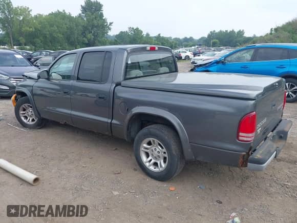 2003 Dodge Dakota Sport with VIN 1D7HL38X13S234210, listed as a IAAI auction lot 42913327 with 173,497 mi miles and . Bid and sale history available at DreamBid. Image 3.