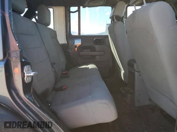 2007 Jeep Wrangler Unlimited Sahara z VIN 1J4GA59127L101693, wystawiony jako Copart lot #84449745 z przebiegiem 226 790 mil mil oraz Szkoda całkowita • Salvage title. Historia ofert i sprzedaży dostępna na DreamBid. Obrazek 11.