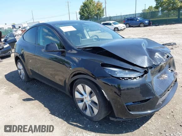 2023 Tesla Model Y Long Range z VIN 7SAYGDEE0PA201841, wystawiony jako IAAI lot #43158634 z przebiegiem 10 356 mil mil oraz . Historia ofert i sprzedaży dostępna na DreamBid. Obrazek 1.