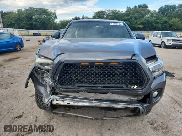 2017 Toyota Tacoma TRD Off Road with VIN 5TFAZ5CN5HX051799, listed as a Copart auction lot 83802125 with 98,027 mi miles and Salvage title. Bid and sale history available at DreamBid. Image 5.