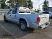 2002 Dodge Dakota Sport z VIN 1B7HL38N72S525267, wystawiony jako Copart lot #43266835 z przebiegiem 249 502 mil mil oraz Szkoda całkowita • Salvage title. Historia ofert i sprzedaży dostępna na DreamBid. Obrazek 2.