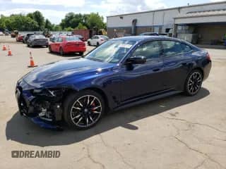 2023 BMW i4 M50 with VIN WBY33AW03PFP82950, listed as a Copart auction lot 65952215 with 18,060 mi miles and Salvage title. Bid and sale history available at DreamBid. Image 1.