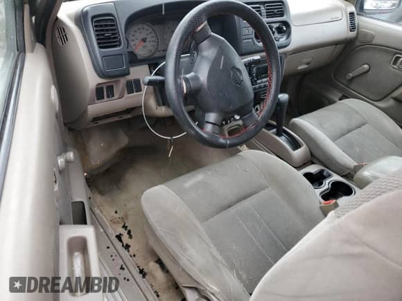 2001 Nissan Frontier SE Desert Runner with VIN 1N6ED26T81C340064, listed as a Copart auction lot 88219545 with 184,623 mi miles and Salvage title. Bid and sale history available at DreamBid. Image 8.