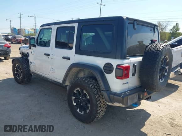 2024 Jeep Wrangler Rubicon with VIN 1C4RJXR60RW223430, listed as a IAAI auction lot 43343638 with 53,374 mi miles and . Bid and sale history available at DreamBid. Image 3.