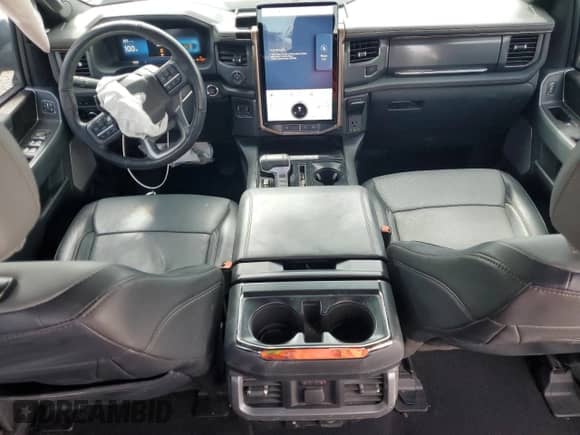 2023 Ford F-150 Lightning Pro with VIN 1FTVW1EV9PWG26295, listed as a Copart auction lot 80298305 with 43,492 mi miles and Salvage title. Bid and sale history available at DreamBid. Image 8.