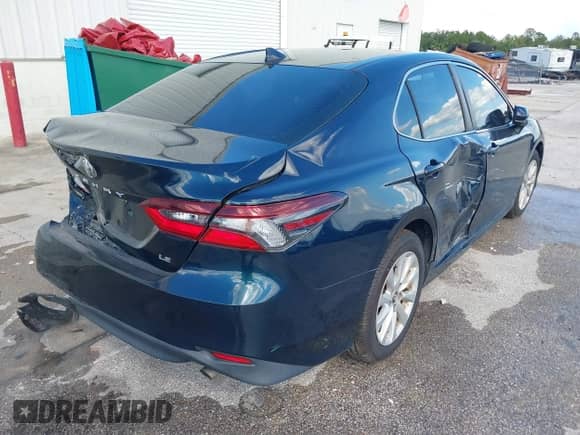 2021 Toyota Camry LE with VIN 4T1C11AK2MU534448, listed as a IAAI auction lot 43111658 with 89,877 mi miles and . Bid and sale history available at DreamBid. Image 4.