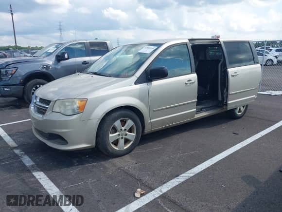 2013 Dodge Grand Caravan SE with VIN 2C4RDGBG0DR736480, listed as a IAAI auction lot 42885110 with 157,685 mi miles and . Bid and sale history available at DreamBid. Image 2.