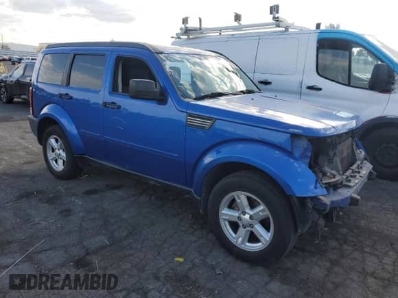 2007 Dodge Nitro SLT with VIN 1D8GT58K97W666341, listed as a Copart auction lot 69343634 with 168,897 mi miles and Salvage title. Bid and sale history available at DreamBid. Image 4.