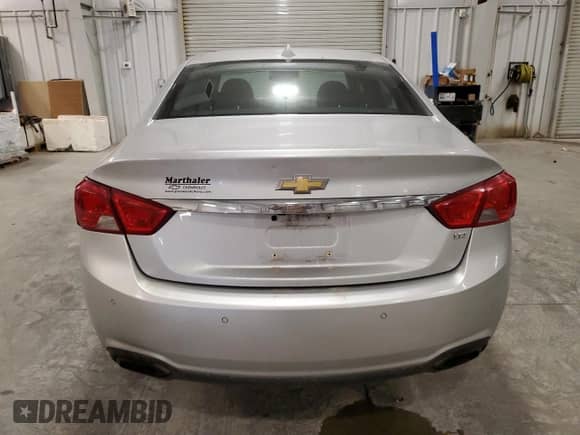 2014 Chevrolet Impala LTZ with VIN 1G1145SL9EU138853, listed as a Copart auction lot 90234735 with 181,122 mi miles and Salvage title. Bid and sale history available at DreamBid. Image 6.