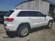 2014 Jeep Grand Cherokee Laredo with VIN 1C4RJEAGXEC157778, listed as a Copart auction lot 65999535 with 124,804 mi miles and Salvage title. Bid and sale history available at DreamBid. Image 3.