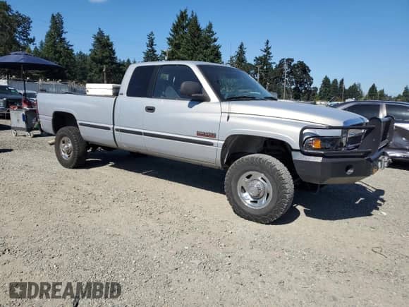 1999 Dodge 2500 with VIN 1B7KF2362XJ531322, listed as a Copart auction lot 80100015 with 222,772 mi miles and Salvage title. Bid and sale history available at DreamBid. Image 4.