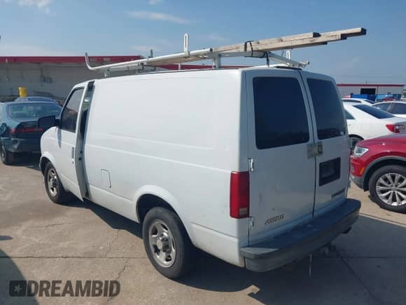 2003 Chevrolet Astro Cargo z VIN 1GCDM19X23B127854, wystawiony jako IAAI lot #42398731 z przebiegiem 174 380 mil mil oraz . Historia ofert i sprzedaży dostępna na DreamBid. Obrazek 3.