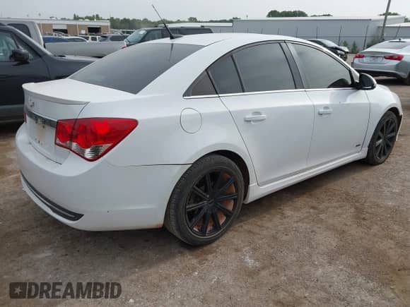 2014 Chevrolet Cruze 2LT with VIN 1G1PE5SB5E7364675, listed as a IAAI auction lot 43183873 with 140,889 mi miles and . Bid and sale history available at DreamBid. Image 4.