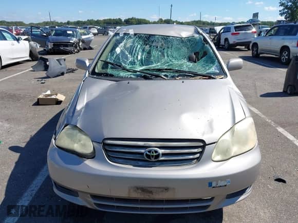 2003 Toyota Corolla CE z VIN 2T1BR32E53C088675, wystawiony jako IAAI lot #43262115 z przebiegiem 275 597 mil mil oraz . Historia ofert i sprzedaży dostępna na DreamBid. Obrazek 6.