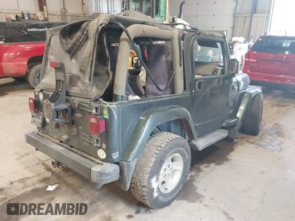 2003 Jeep Wrangler Sahara с VIN 1J4FA59S73P307373, выставлен на аукционе IAAI как лот 42542540 с пробегом 131 112 миль миль и . История ставок и продаж доступна на DreamBid. Изображение 4.