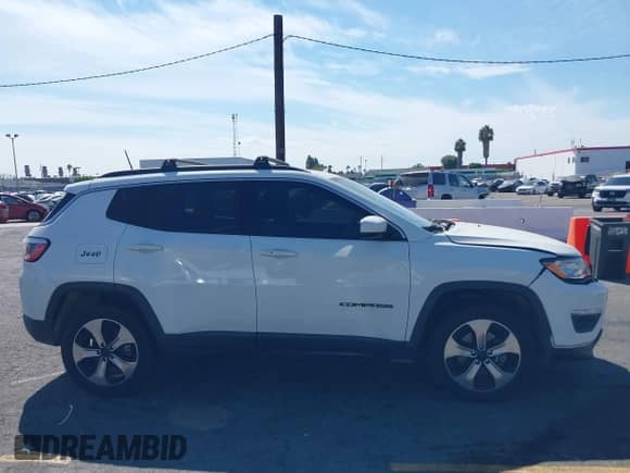 2017 Jeep Compass Latitude z VIN 3C4NJDBB8HT666563, wystawiony jako IAAI lot #43228511 z przebiegiem 116 669 mil mil oraz . Historia ofert i sprzedaży dostępna na DreamBid. Obrazek 13.