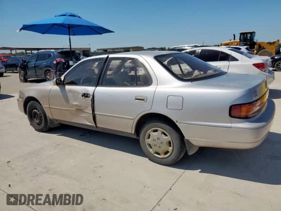 1994 Toyota Camry LE z VIN 4T1SK12E9RU373329, wystawiony jako Copart lot #71214485 z przebiegiem 186 302 mil mil oraz Szkoda całkowita • Salvage title. Historia ofert i sprzedaży dostępna na DreamBid. Obrazek 2.