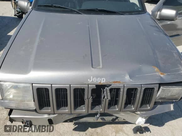 1998 Jeep Grand Cherokee Limited z VIN 1J4GZ78S5WC325148, wystawiony jako Copart lot #67780424 z przebiegiem Nie podano mil oraz Szkoda całkowita • Salvage title. Historia ofert i sprzedaży dostępna na DreamBid. Obrazek 11.
